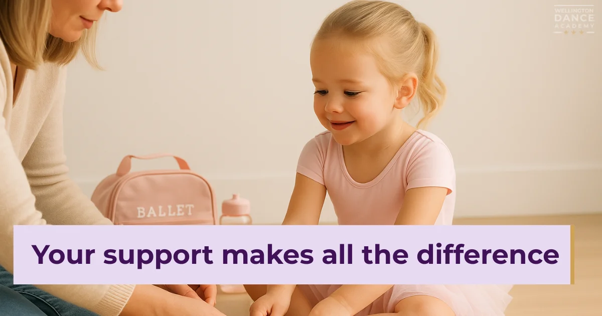 Mom helping young ballerina prepare with pink ballet bag beside them.