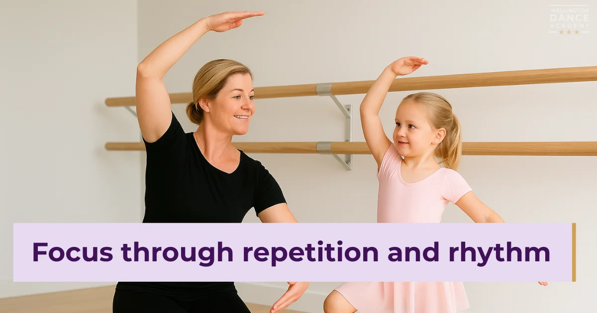Ballet teacher and young girl practicing balance and rhythm in class.